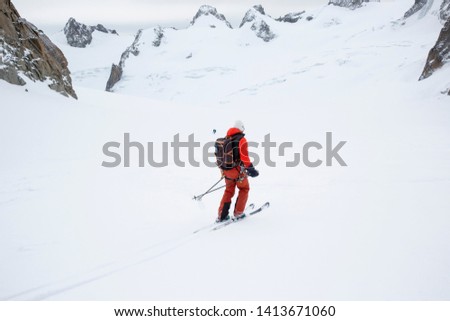 Extreme skier and mountaineer skiing the off piste Valle Blanche run in the Mont Blanc Massif in Chamonix, France