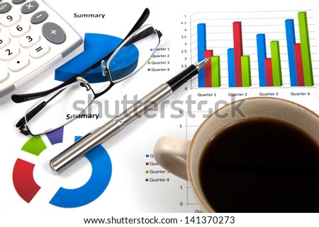 Business report with cup of coffee