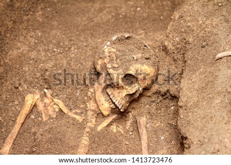Archaeological discovery of a tomb with an intact skeleton in Taranto, Puglia, Italy Royalty-Free Stock Photo #1413723476