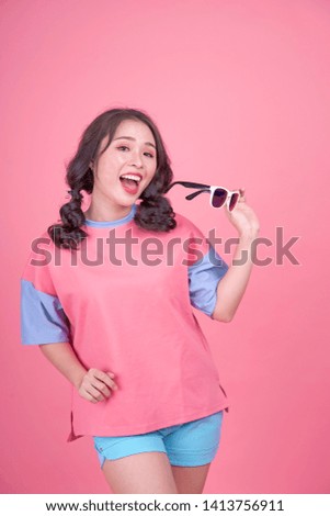 Asian young beautiful attractive pretty woman is on travel with pinky background