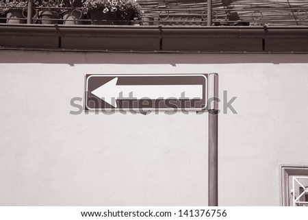 Arrow Direction Sign in Black and White Sepia Tone