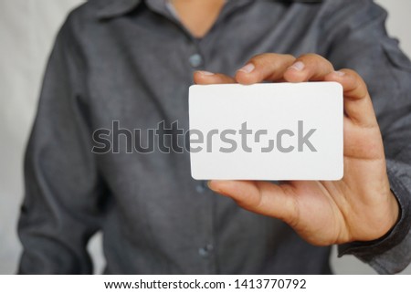 People holding a business card Royalty-Free Stock Photo #1413770792