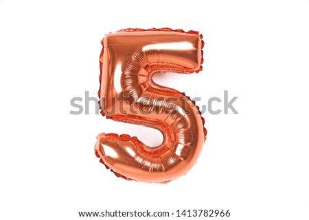 Golden foil number party balloon isolated on white background