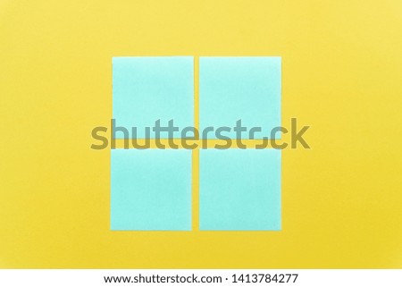 Colorful sticky notes on a free yellow background space