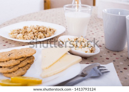 healthy breakfast of oatmeal, biscuits and juice and milk