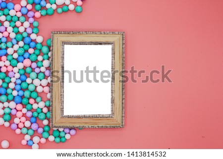 The frame art with white on pink background and foam colorful