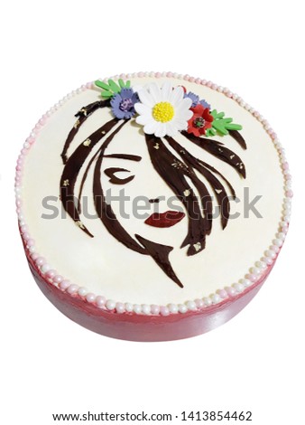 Cake with a picture of a woman made of marmalade and flowers on a white background