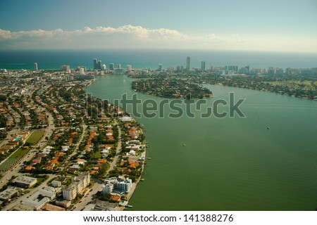Aerial view of sprawling suburbs of Miami city waterfront, Florida, U.S.A.