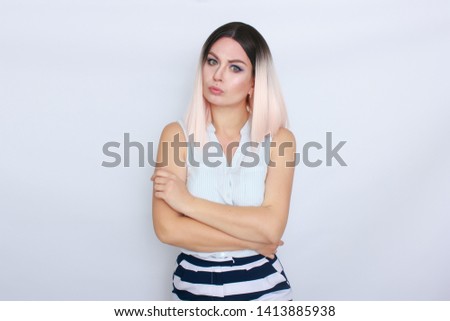 Portrait of happy lovely blonde woman standing isolated over white background, wearing summer shorts and blouse