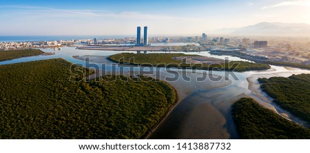 Panoramic view of Ras al Khaimah over mangrove forest in the UAE United Arab Emirates aerial Royalty-Free Stock Photo #1413887732