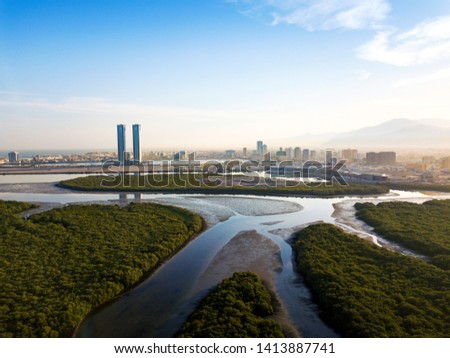 Panoramic view of Ras al Khaimah over mangrove forest in the UAE United Arab Emirates aerial Royalty-Free Stock Photo #1413887741