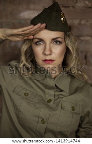 Beautiful army girl praying to clasp her hands, female soldier in military uniform