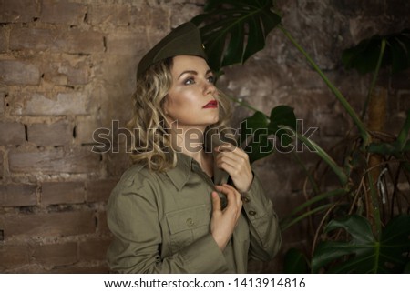 Beautiful army girl praying to clasp her hands, female soldier in military uniform