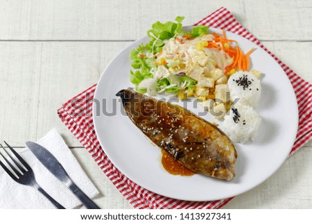 saba fish grilled soy sauce with vegetable salad and japanese rice with black sesame seed sprinkles
