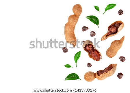 Tamarind fruit with leaf and seed isolated on white background with copy space for your text. Top view. Flat lay
