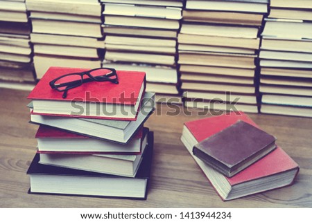 Glasses on the background of books. Symbol of knowledge, science, study, wisdom.