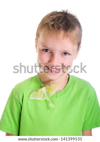 Portrait of a boy with a butterfly on the moon t-shirt