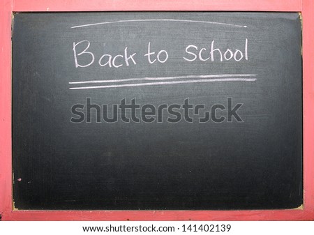 Back to school handwriting on blackboard background
