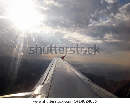 Under the wing of the plane. Panoramic views of the sky and the earth from the window of the plane. Europe.2019