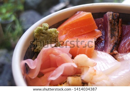 Steamed rice topped with sashimi - Japanese traditional sushi