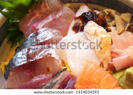 Steamed rice topped with sashimi - Japanese traditional sushi