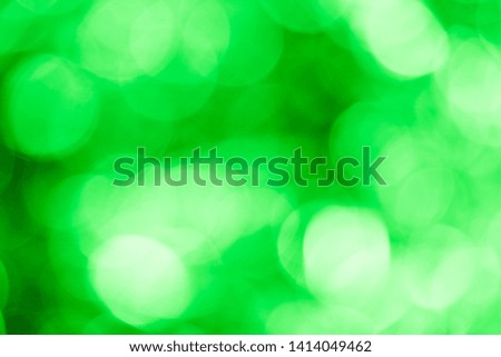 Green glowing blurred background with bokeh, photo