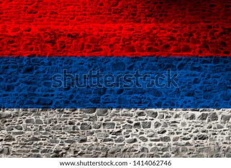 National colorful russian flag on old stone wall