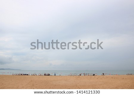 People on the Beach, Chairs on beach with clear sea and sand under blue sky in summer