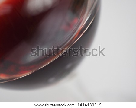 closeup wine glass sitting on white tablecloth