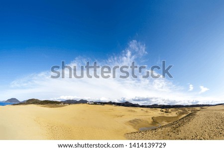 Tottori sand dune in Tottori prefecture is famous for Japan. It is sand dune seaside background is blue sky with copy space.