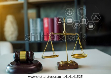 Concept of justice. law theme wooden desk, books, balance. Law concept. In morning light
