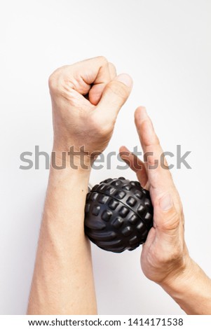 Massage by using roller ball to relieve sore muscles after exercise can be used for sport and health or life style article Royalty-Free Stock Photo #1414171538