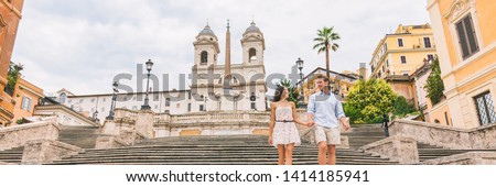 Luxury Europe travel couple on honeymoon vacation walking down Spanish steps stairs in Rome, Italy. European cruise destination italian summer holiday tourists horizontal banner panorama.