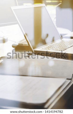 Laptop and papers on desk double exposure