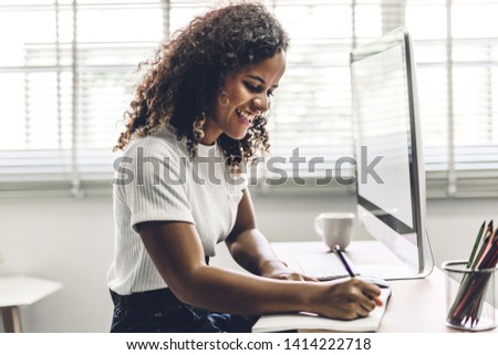 African american black woman working with laptop computer.creative business people planning and using pen in modern work loft