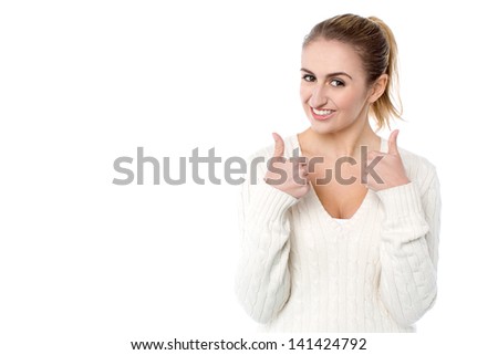 Young smiling girl showing double thumbs up