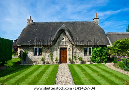Thatched Cottage Royalty-Free Stock Photo #141426904