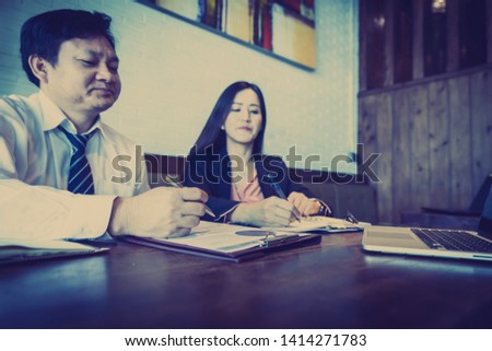 Discussing plan and idea to improvement strategy, businessmen brainstorming for strategy of business investment,businessmen review chart and document of investment information
