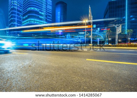 light trails in the downtown district, china