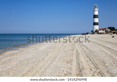 Seascape landscape with old lighthouse background