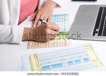  woman in office doing paperwork