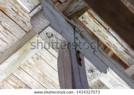 Wooden support structure close-up. Visible Metal screed bolt-on to enhance. Bottom view, also on the floor boards