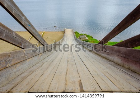 wooden slide leading to the lake