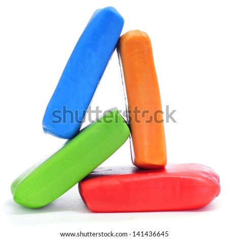 bars of rolled fondant of different colors on a white background