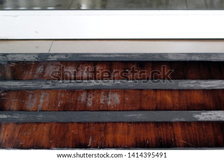 Wooden floor with anti-slip strips.