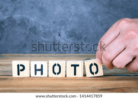 Photo - word from wooden letters on wooden table