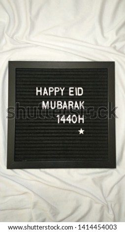 Eid Mubarak 1440 H/2019 greeting on black signboard over the white background