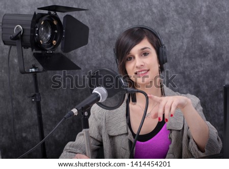 a young woman working on the radio