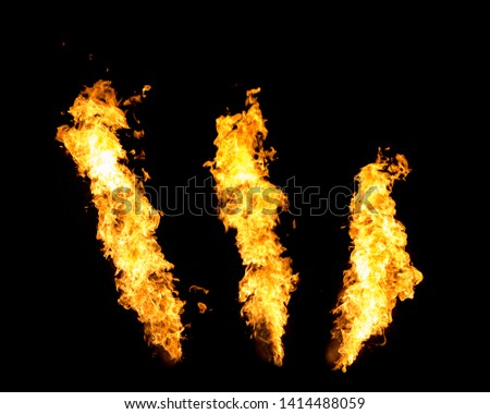 Three fire jets isolated on black background, flame stream Royalty-Free Stock Photo #1414488059