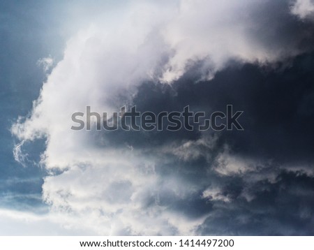dark cumulus clouds on a bright sky before a thunderstorm.